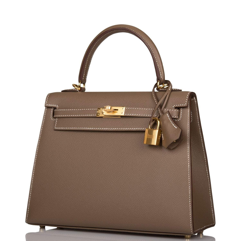 A shot of the removable shoulder strap and its gold-tone clasps