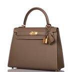 A shot of the removable shoulder strap and its gold-tone clasps