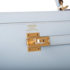 A shot of the removable shoulder strap and its gold-tone clasps