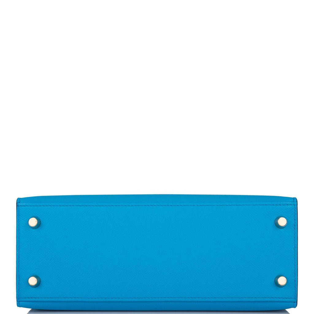 A view of the rolled top handle and the shoulder strap connection points