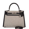 Front view of the Hermes Kelly Sellier 28 in black Toile and Swift leather