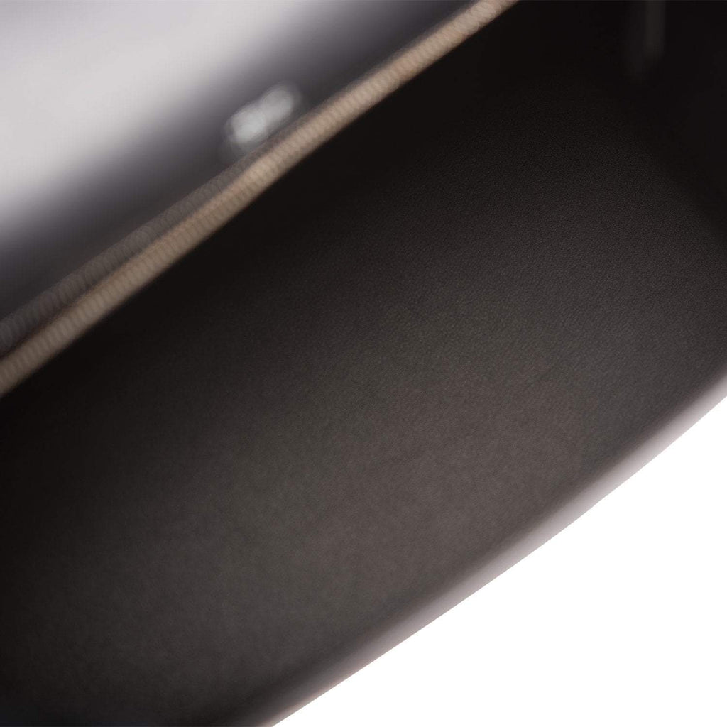 The Hermes Kelly Sellier 28 displayed on a surface, highlighting its structured form