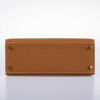 Hermes Kelly 28 Sellier Gold Epsom with Gold Hardware, A view of the base of the bag, showing the protective m