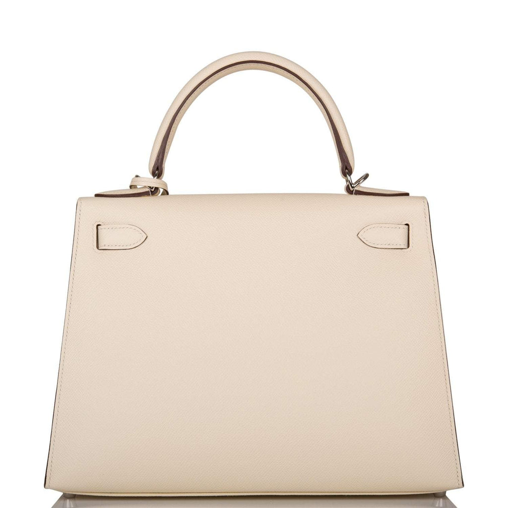 Hermes Nata Verso Epsom Sellier Kelly 28cm Palladium Hardware, A close-up shot of the gold-tone padlock and tw