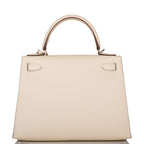 Hermes Nata Verso Epsom Sellier Kelly 28cm Palladium Hardware, A close-up shot of the gold-tone padlock and tw
