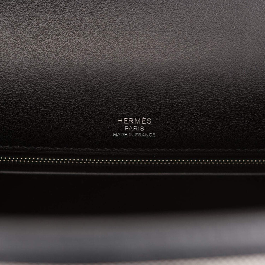 Image of the interior, showing the zip pocket and two open pockets