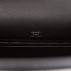 Image of the interior, showing the zip pocket and two open pockets