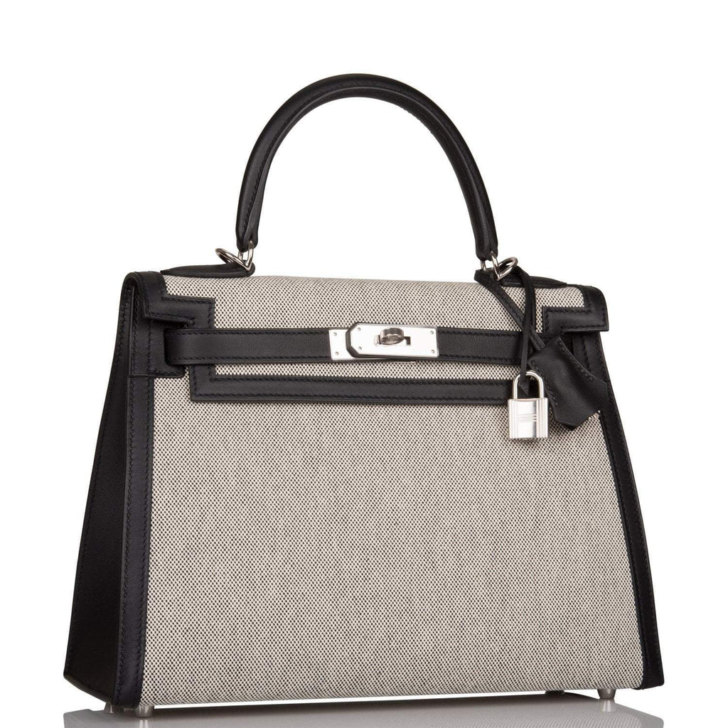 Close-up of the palladium-tone hardware and toggle closure on the Hermes Kelly 28
