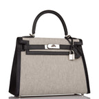 Close-up of the palladium-tone hardware and toggle closure on the Hermes Kelly 28