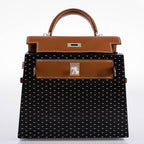 A view of the Barenia leather trim on the flap and handle