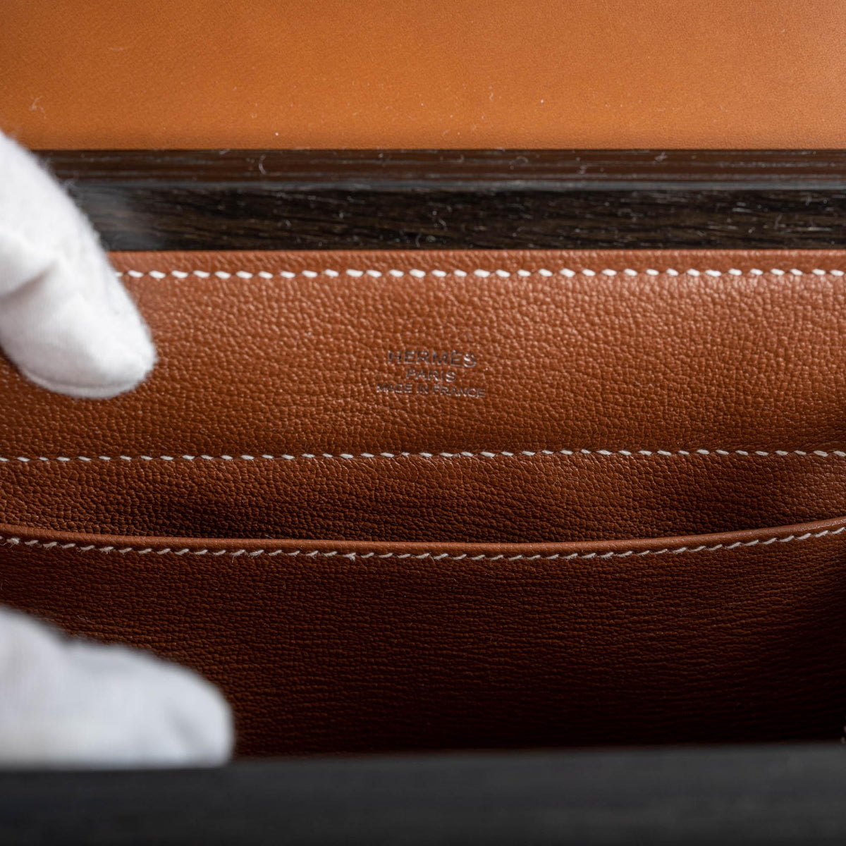 A shot highlighting the contrast between the Bog Oak wood and the Barenia leather