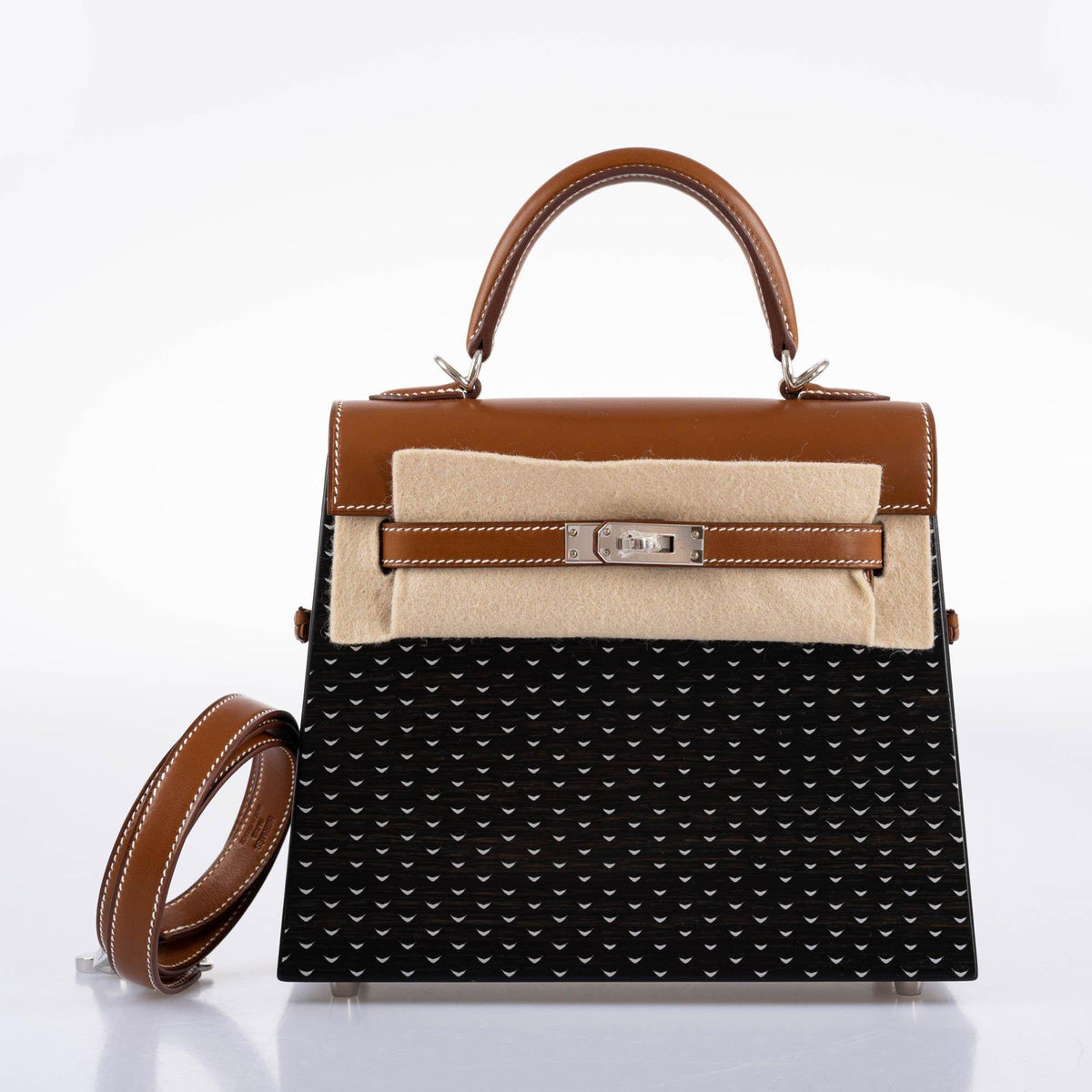 Detail shot of the palladium-tone hardware and toggle closure