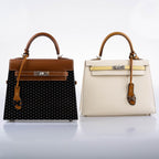 The top handle of the bag, showing the Barenia leather and design