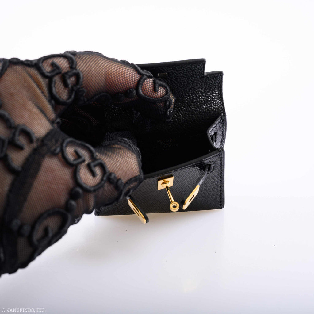 Close-up of the gold-tone hardware and toggle closure on the Kelly Charm