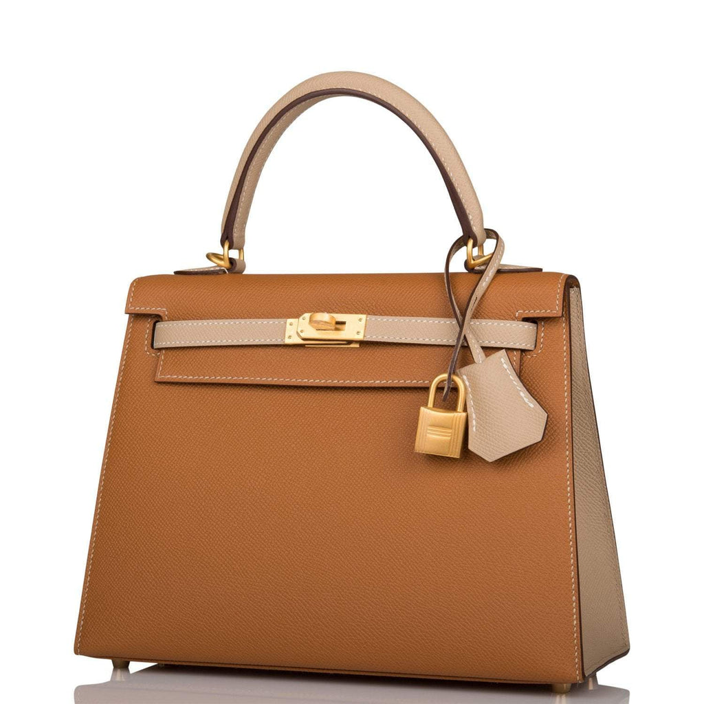 A view of the signature brushed gold-tone turn-lock on the front flap of the bag