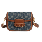 Gucci Blue GG Denim Horsebit 1955 Mini Crossbody Bag - Blue in Blue - side view showing the bag's shape, finish and visible design details.