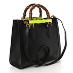 Gucci Diana Medium Tote Bag - Black in Black - side view showing the bag's shape, finish and visible design details.