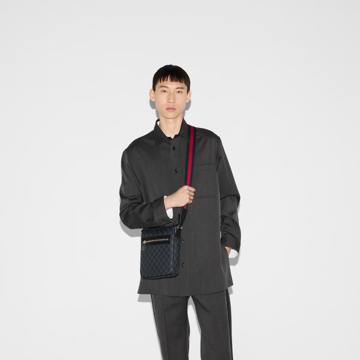Gucci GG Black Small Messenger Bag - Black in Black - detail view 8 showing the bag's shape, material finish and visible design details.