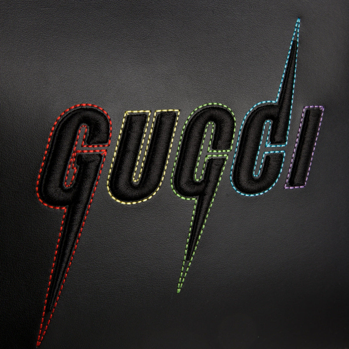 Gucci Blade Embroidered Leather Clutch Pouch - Black in Black - detail view 5 showing the bag's shape, finish and visible design details.