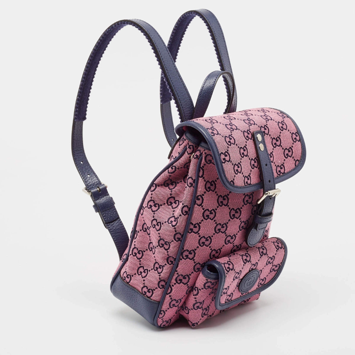 Gucci GG Canvas Backpack - Pink in Pink - side view showing the bag's shape, material finish and visible design details.