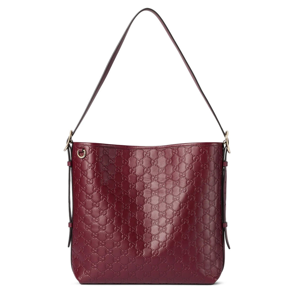 Gucci GG Calfskin Emblem Medium Shoulder Bag - Pink in Pink - front view showing the bag's shape, material finish and visible design details.