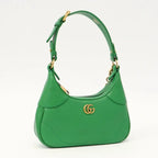 Gucci Aphrodite Small Leather Shoulder Bag - Green in Green - detail view 4 showing the bag's shape, finish and visible design details.