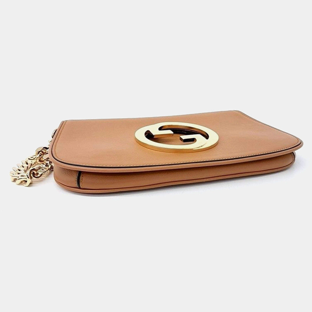 Gucci Blondie Shoulder Bag - Brown in Brown - side view showing the bag's shape, finish and visible design details.