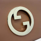 Gucci Blondie Shoulder Bag - Brown in Brown - rear view showing the bag's shape, finish and visible design details.