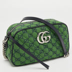 Gucci GG Canvas Marmont Small Shoulder Bag - Green in Green - detail view 4 showing the bag's shape, material finish and visible design details.