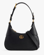 Gucci Aphrodite Small Leather Shoulder Bag - Black in Black - side view showing the bag's shape, finish and visible design details.