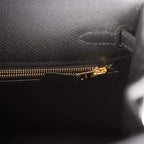 Bottom base view showing gold feet and stitching detail