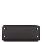 Styled shot of Hermes Kelly 25 being carried with shoulder strap