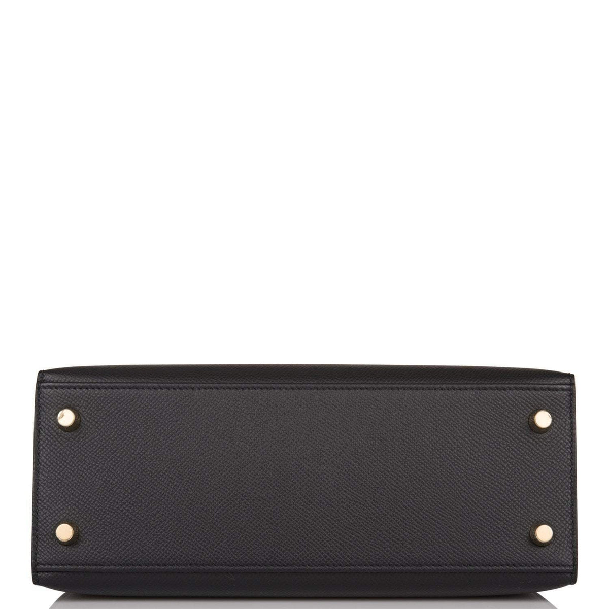 Styled shot of Hermes Kelly 25 being carried with shoulder strap