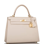 Side profile of Hermes Kelly Sellier 25 in ivory Epsom leather