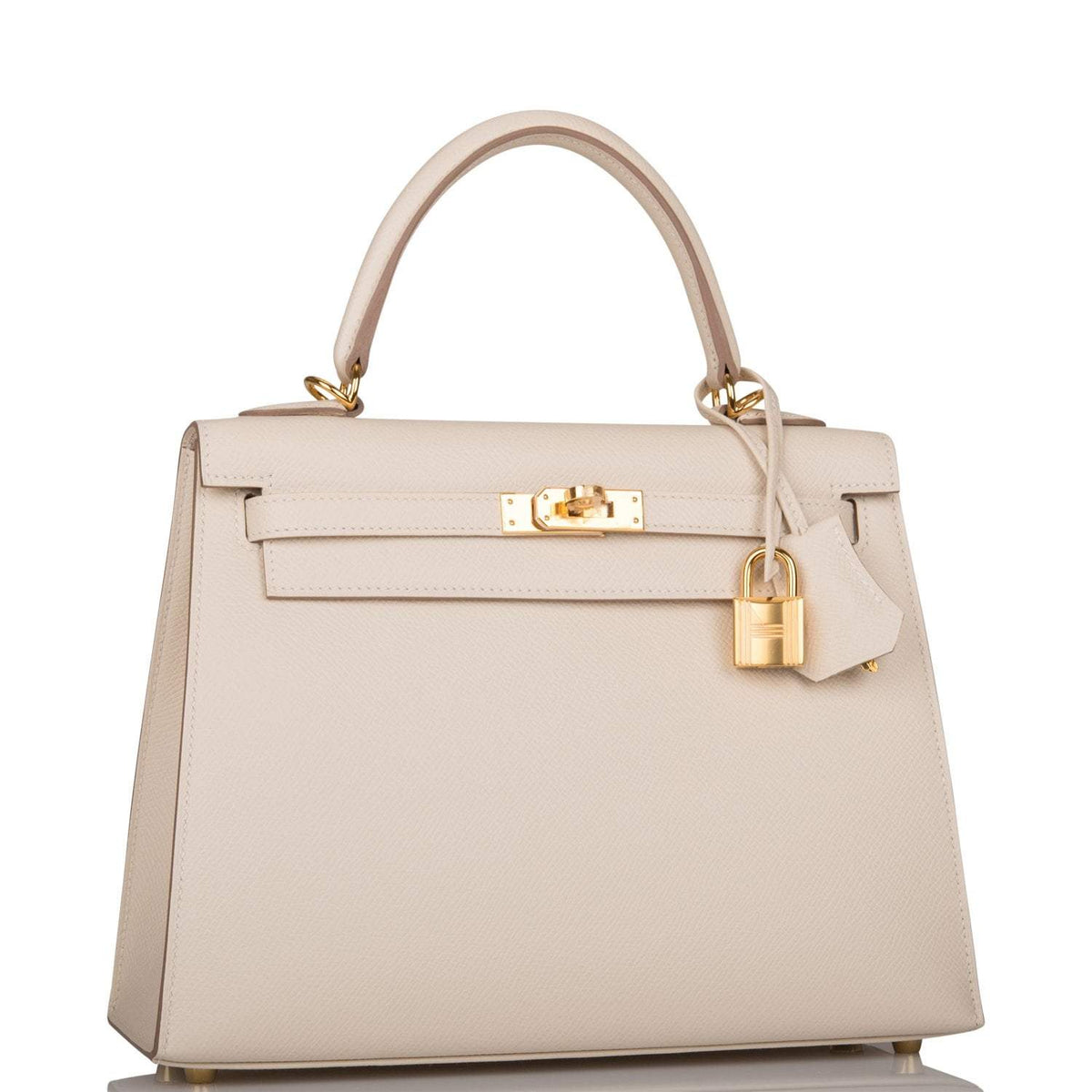 Side profile of Hermes Kelly Sellier 25 in ivory Epsom leather