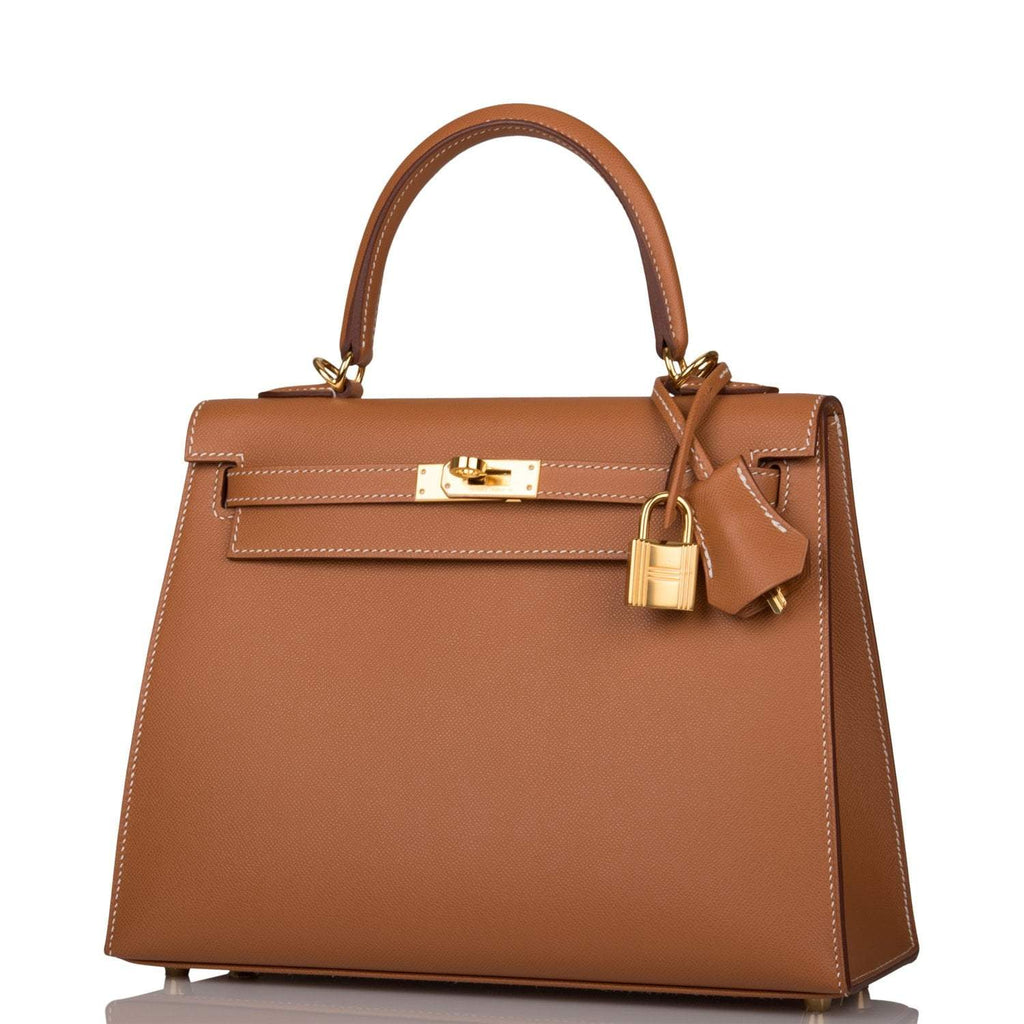 Open interior view lined in gold Chèvre leather with zip pocket