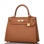 Open interior view lined in gold Chèvre leather with zip pocket