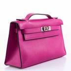 Hermes Kelly Mini Pochette Rose Pourpre Swift Palladium Hardware, Angled view showing saturated Rose Pourpre c
