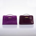 Hermes Kelly Pochette Violet Veau Doblis Suede Palladium Hardware, Scale view of the pochette carried by hand