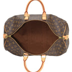 A shot of the monogram pattern next to the natural cowhide trim