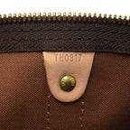 A detail shot of the zipper pull and closure mechanism