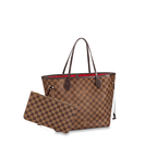 A shot highlighting the contrast between the Damier Ebene canvas and the natural cowhide trim