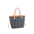 The Louis Vuitton Neverfull MM tote placed on a bench