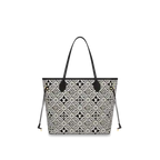 The bag carried over the shoulder, demonstrating its versatile style