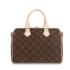 The Louis Vuitton Speedy 25 shown with its removable and adjustable shoulder strap